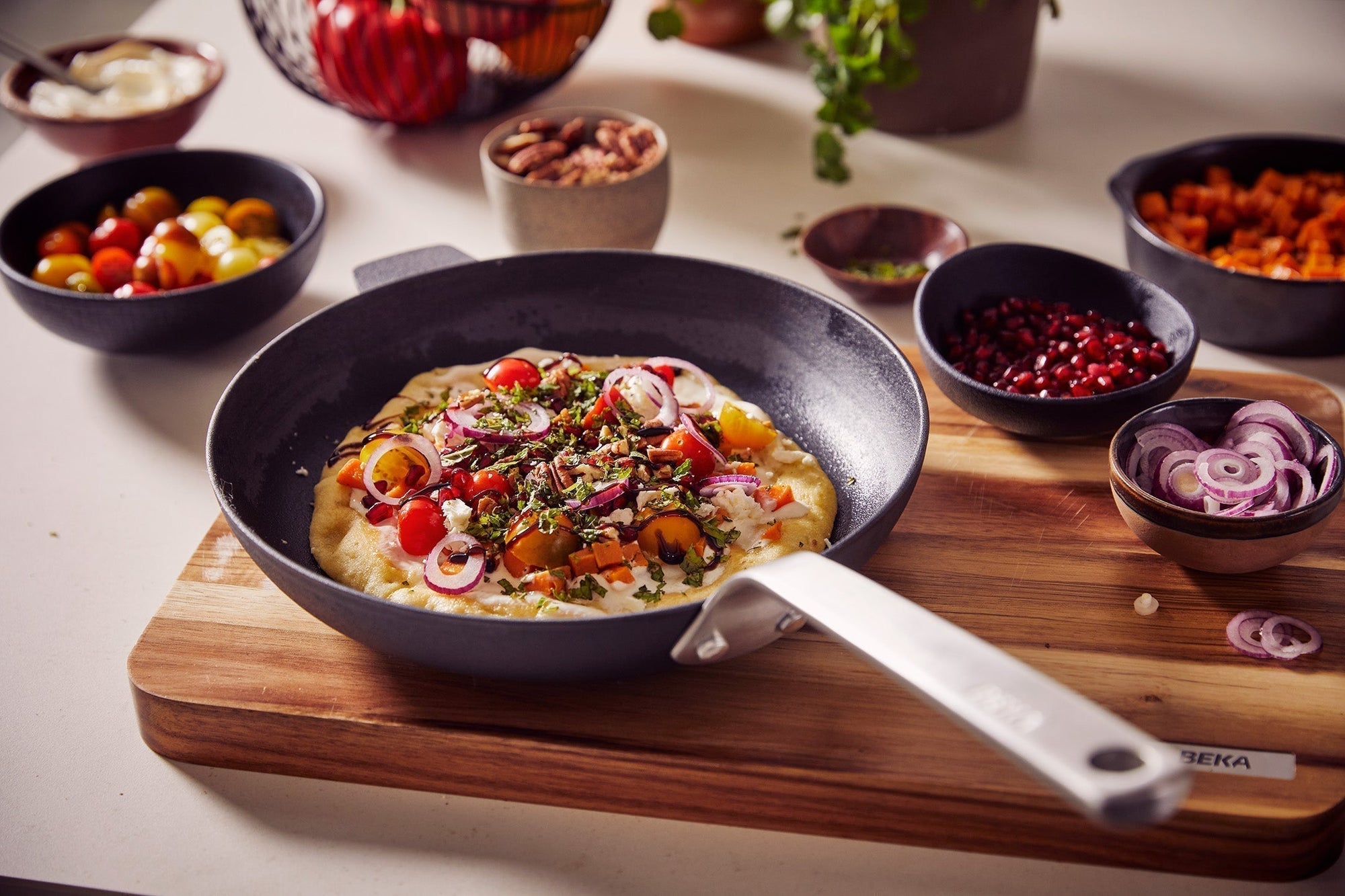 Panpizza met pompoen, feta & granaatappel